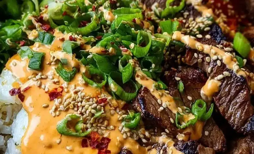 Korean BBQ steak rice bowl with spicy cream sauce served in a bowl