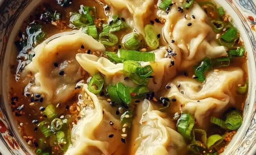 Bowl of flavorful Potsticker Soup with dumplings and fresh vegetables