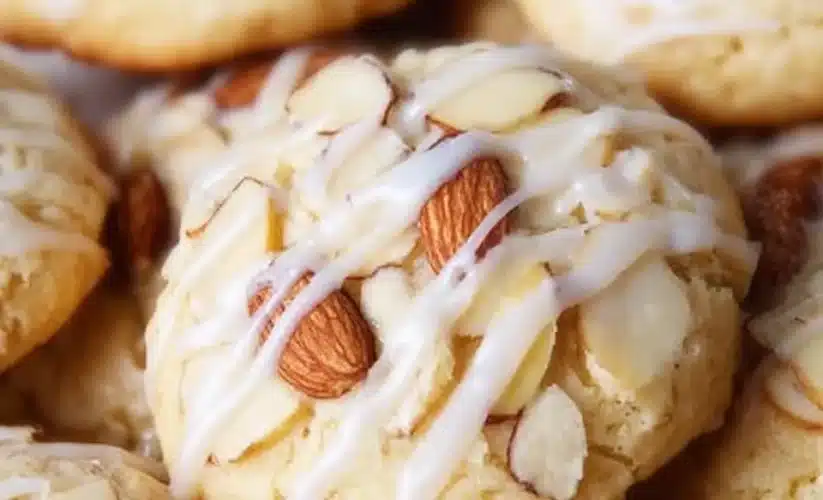 Delicious glazed almond cookies on a wooden plate, perfect for snacking.