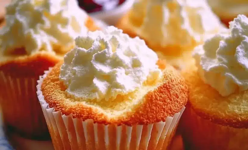 Golden angel food cupcakes topped with a light frosting